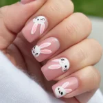 Pink almond funny bunny nails 2026 with glitter and French tip design